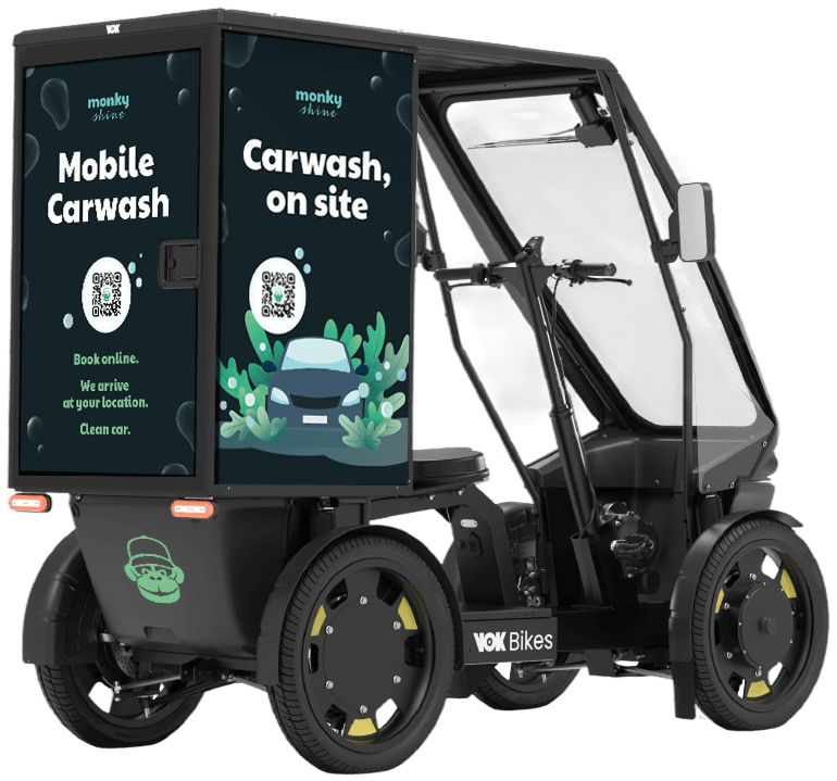 Monky Shines el-ladcykel set bagfra med teksten “Mobile Carwash” på ladet